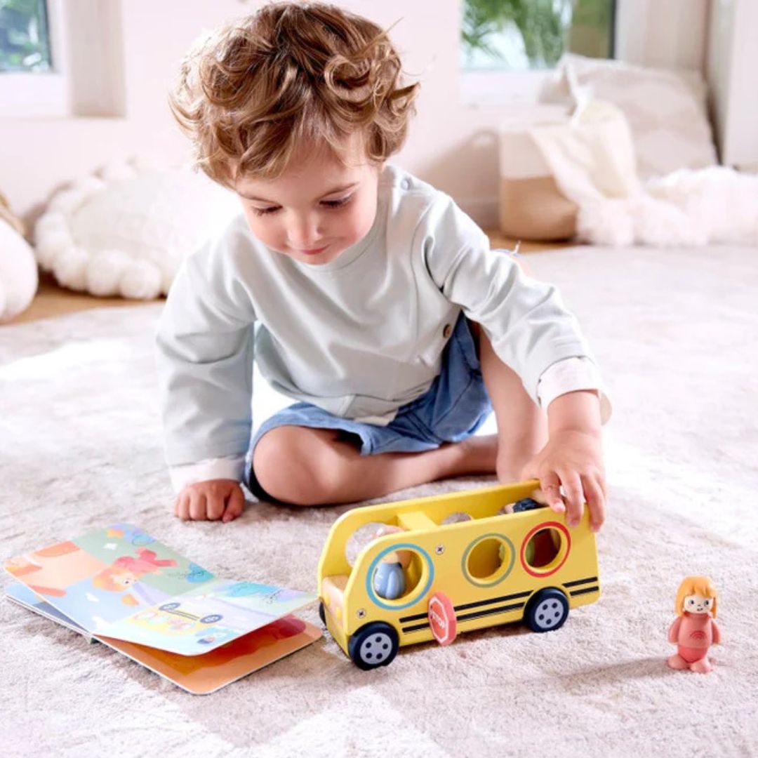 Hape Land | Lively School Bus board book and wooden bus toy available at Bear & Moo