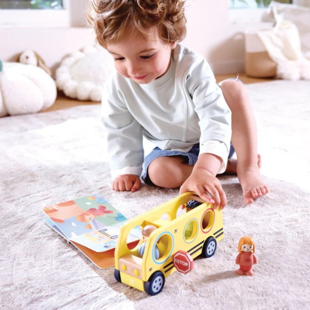 Hape Land | Lively School Bus board book and wooden bus toy available at Bear & Moo