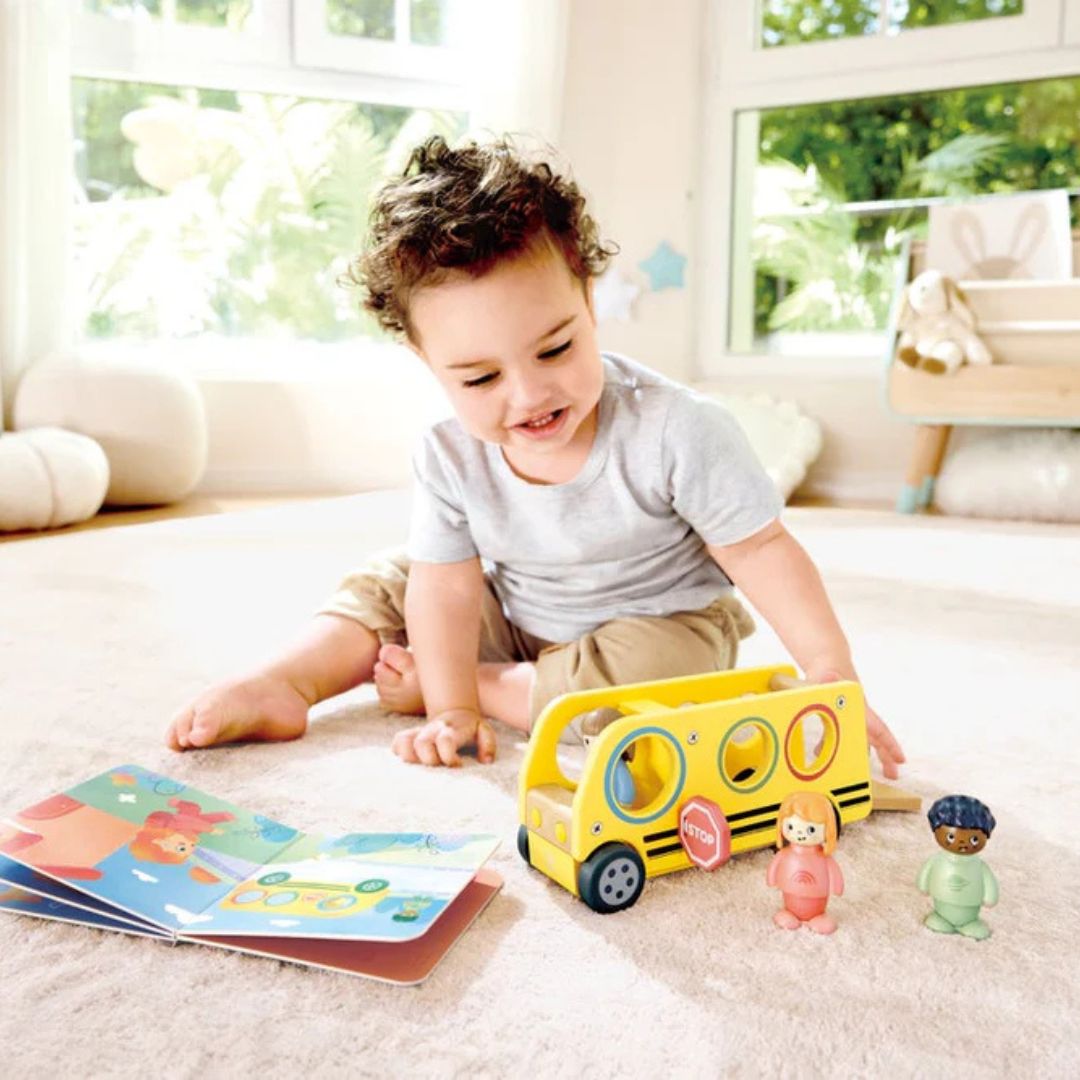 Hape Land | Lively School Bus board book and wooden bus toy available at Bear & Moo
