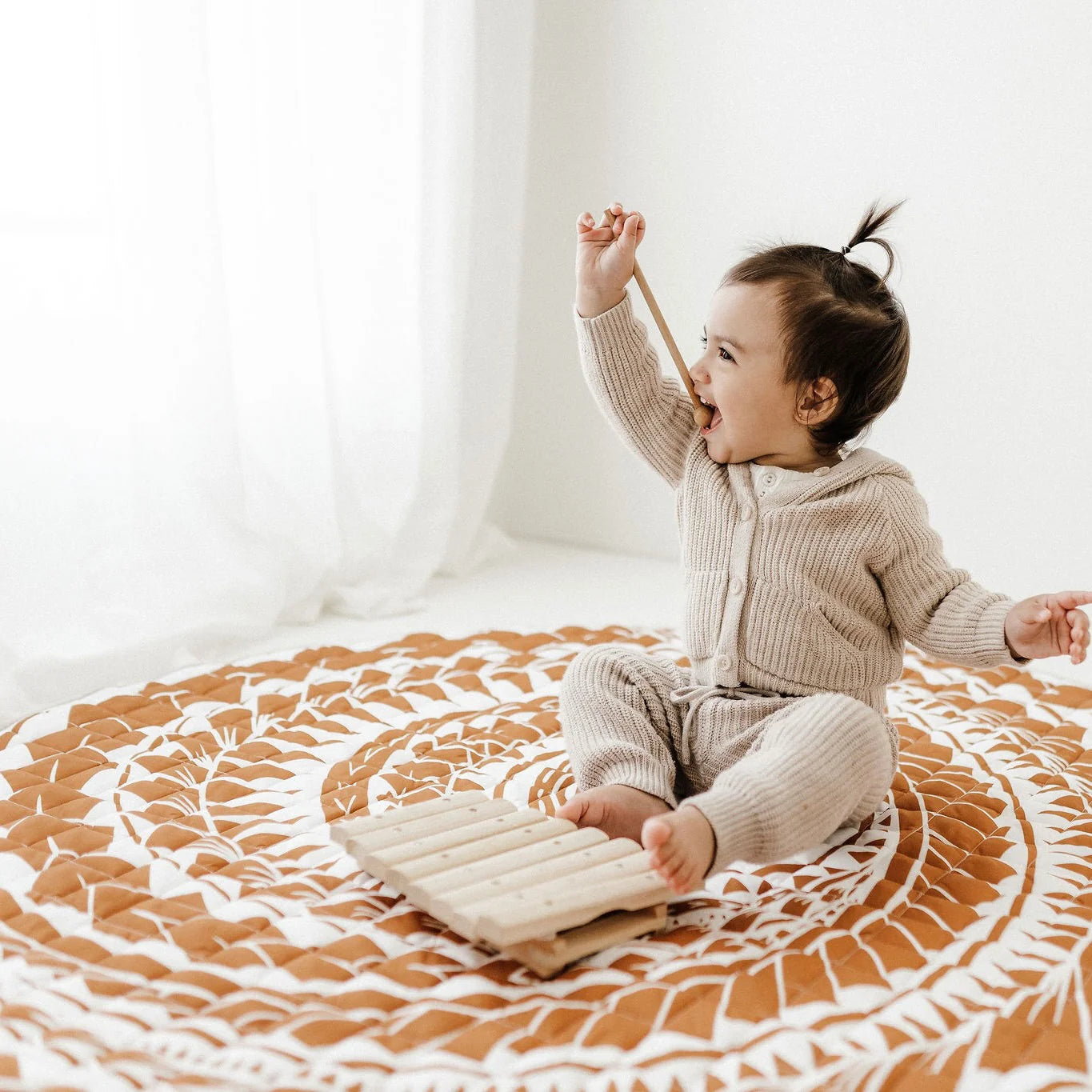 BO & KO Baby Polynesian Inspired Playmat in Rust available at Bear & Moo