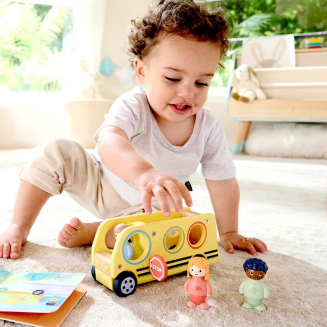Hape Land | Lively School Bus board book and wooden bus toy available at Bear & Moo