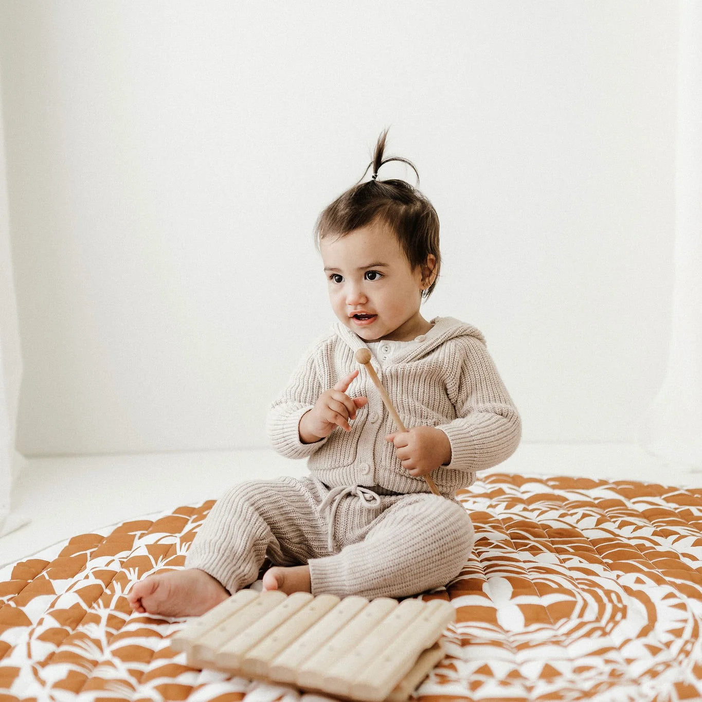 BO & KO Baby Polynesian Inspired Playmat in Rust available at Bear & Moo