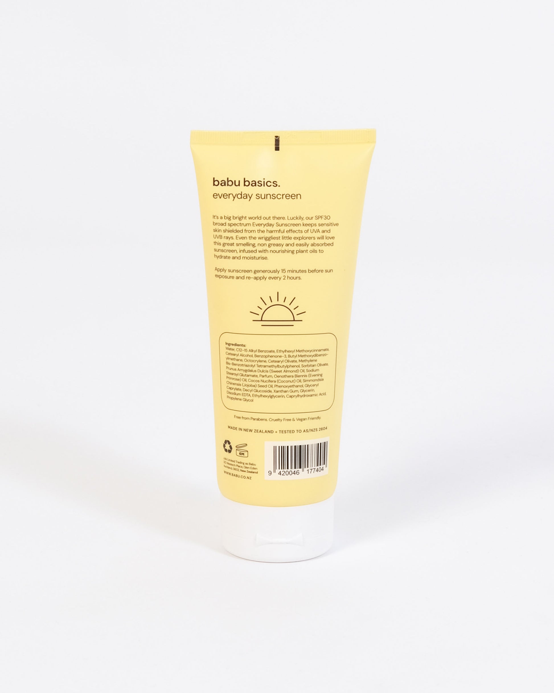 Yellow sunscreen tube labeled 'babu basics' on a white background