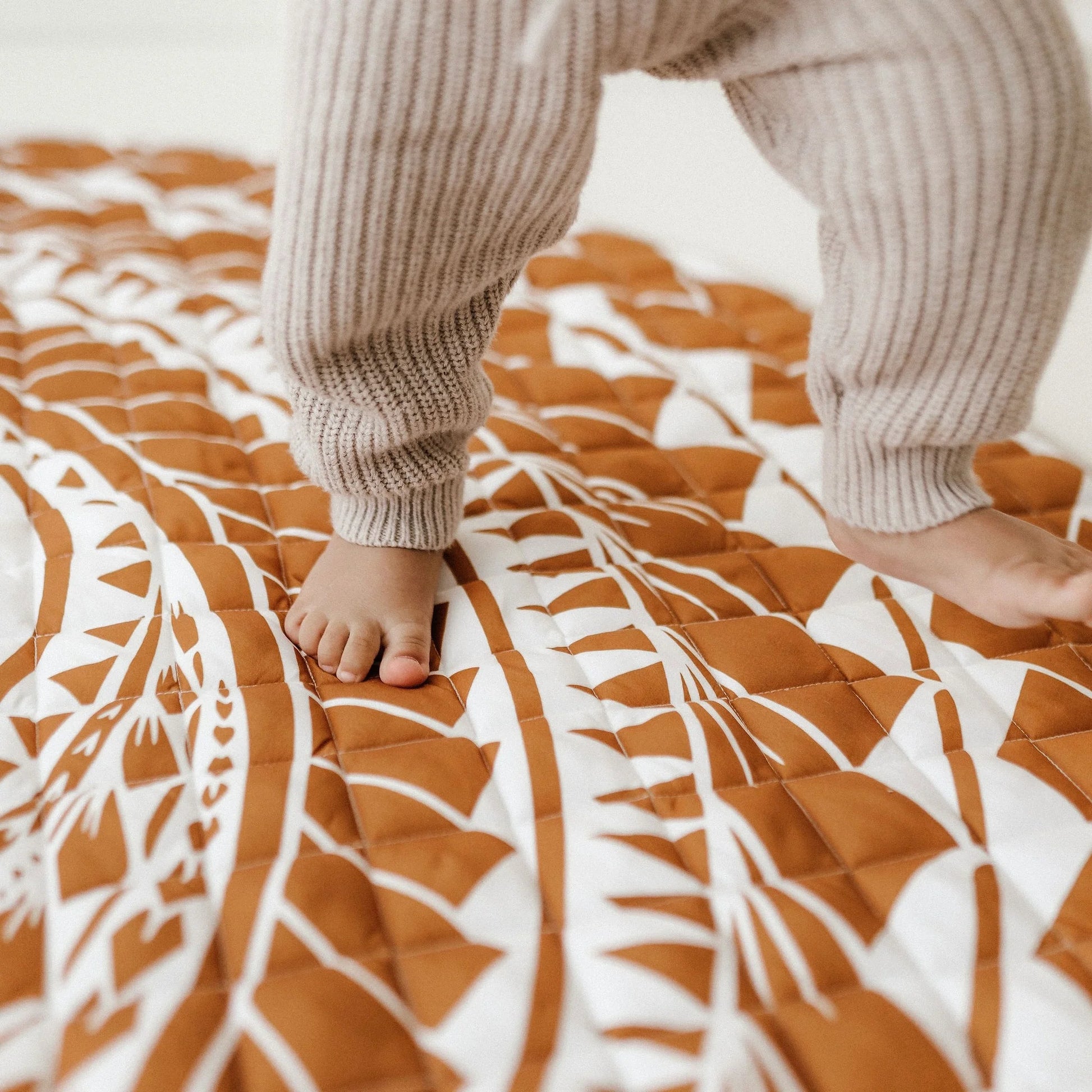 BO & KO Baby Polynesian Inspired Playmat in Rust available at Bear & Moo