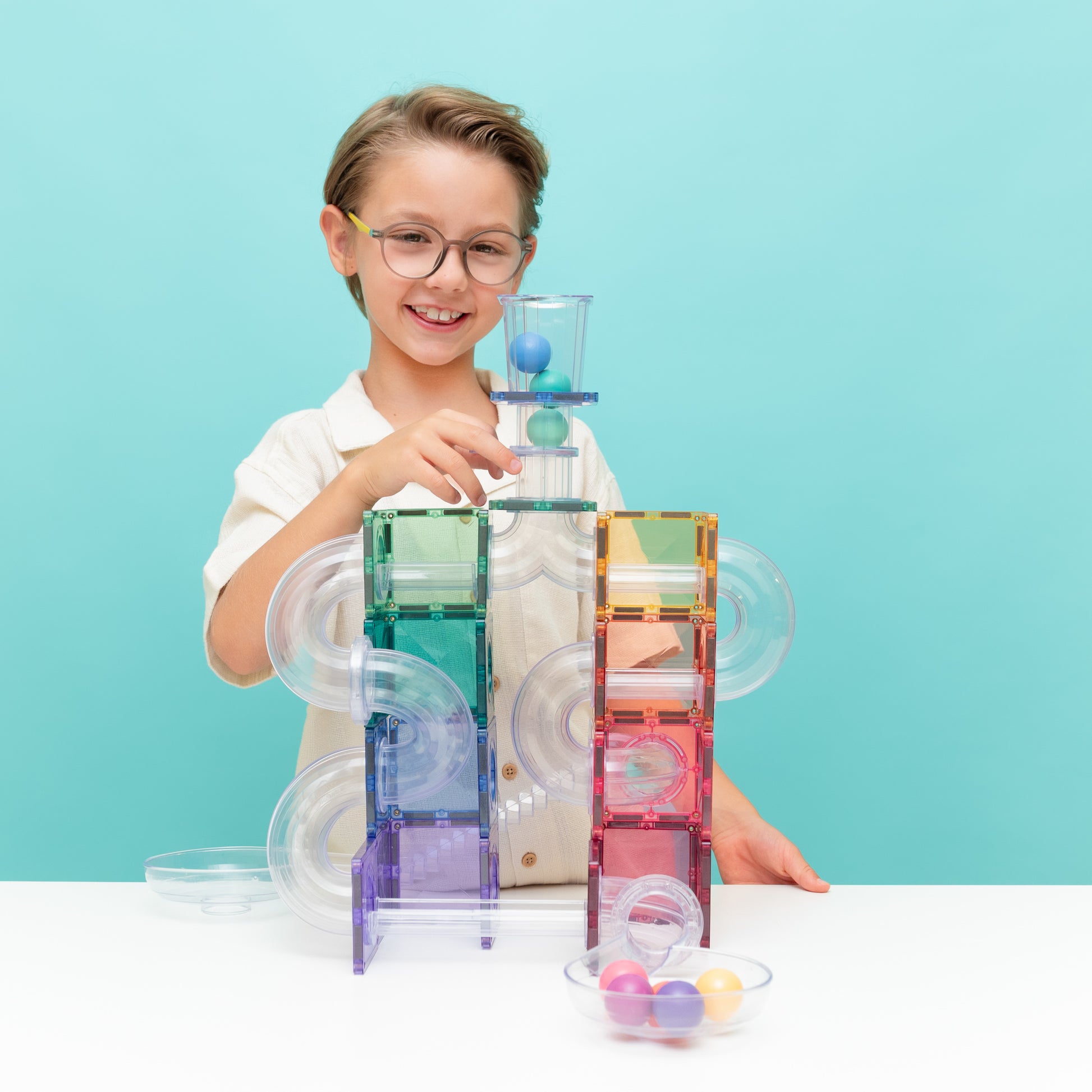 Child playing with CONNETIX 114 Piece Pastel Ball Run Pack