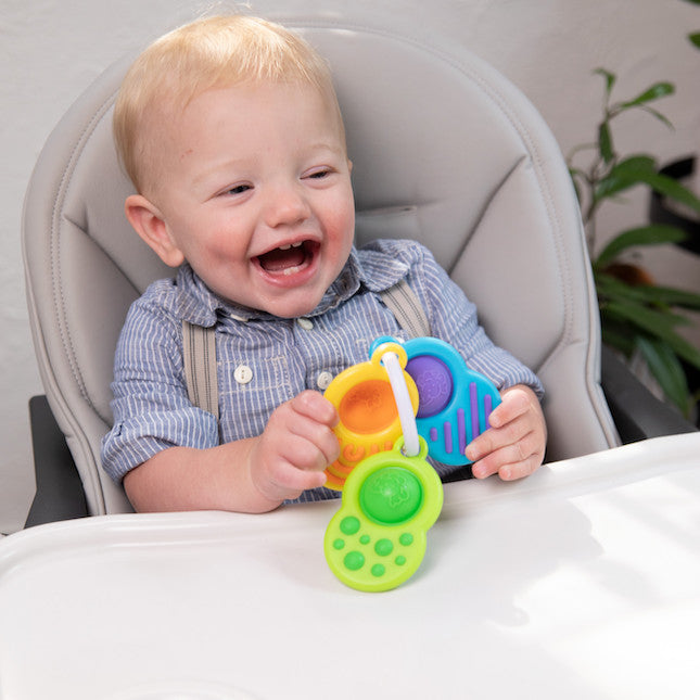 Fat Brain Toy Co Dimpl Clutch available at Bear & Moo | Teething Toy