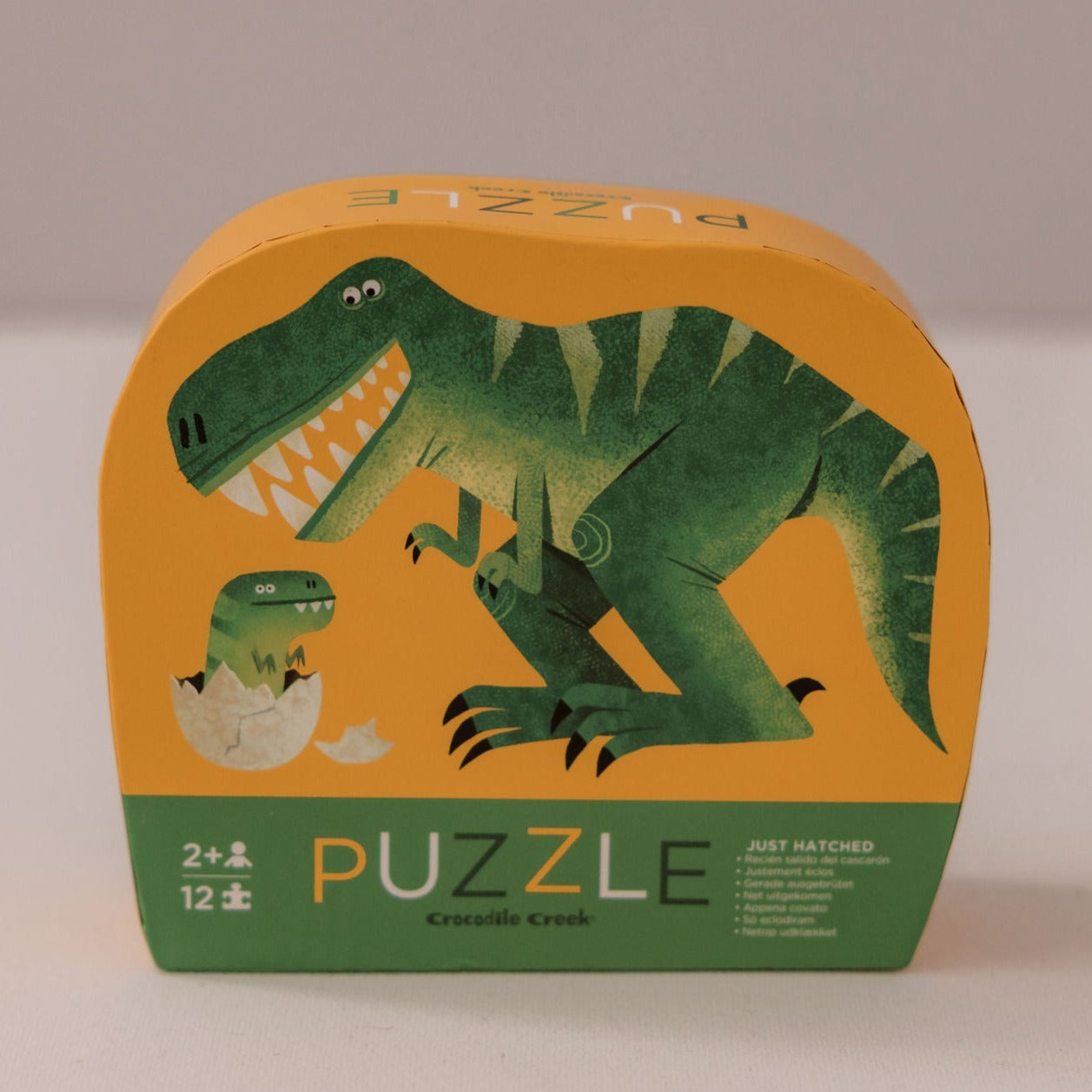 Crocodile Creek Just Hatched Dinosaur 12 Piece Puzzle available at Bear & Moo